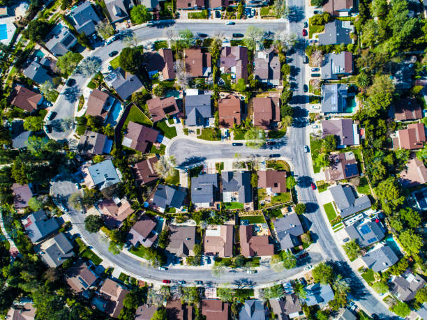 istock Buildings are lining along the road where nature exists. 951033766