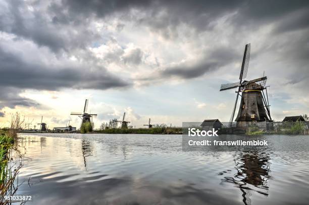 Clouds Over A Canal In Kinderdijk Stock Photo - Download Image Now - Beauty, Canal, Cloud - Sky