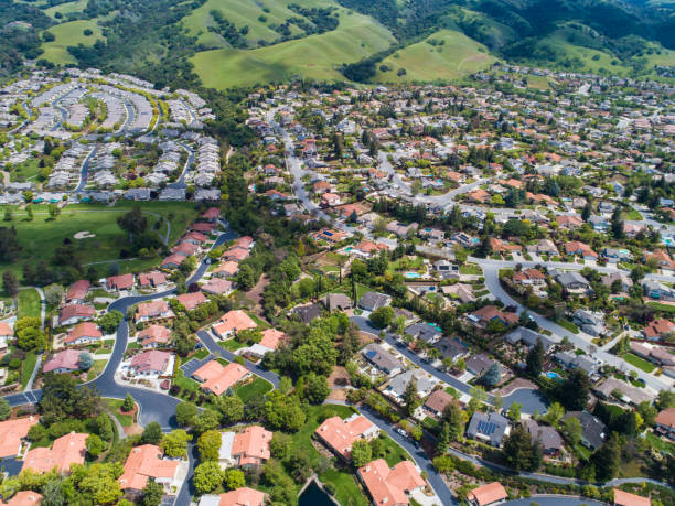 istock Buildings are lining along the road where nature exists. 951034360