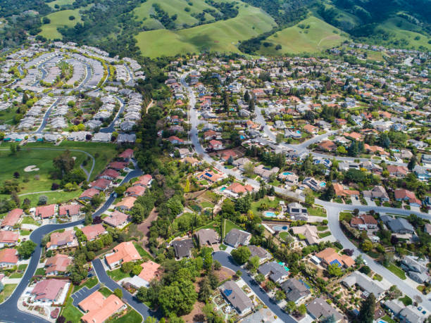 istock Buildings are lining along the road where nature exists. 951034366