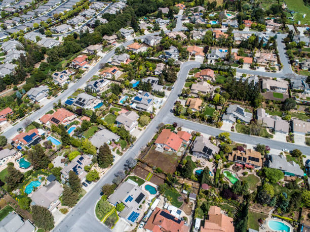 istock Buildings are lining along the road where nature exists. 951034478