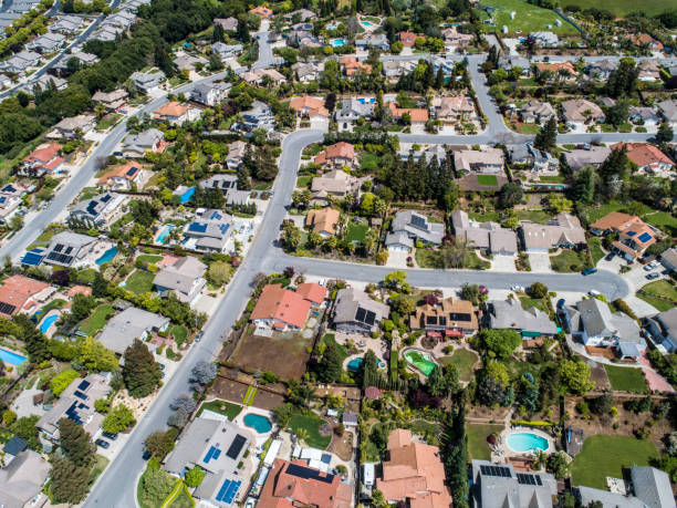 istock Buildings are lining along the road where nature exists. 951034486