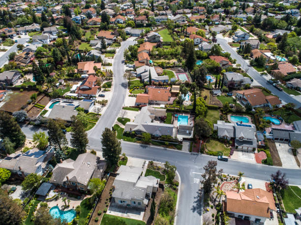 istock Buildings are lining along the road where nature exists. 951034614