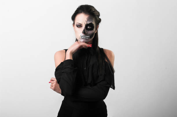 istock Beautiful woman with make-up skeleton 951038332
