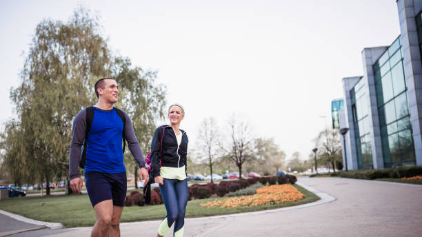 istock Young couple of athletes walking outdoors after training 951040688