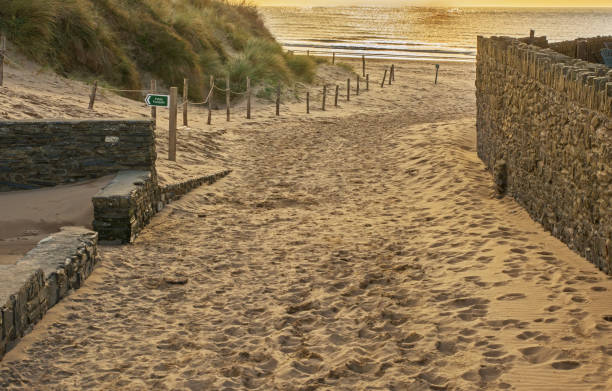 Sandy beach at Croyde, Devon, England Sandy beach at Croyde Bay near Barnstaple in North Devon, England. Path leading to beach. croyde photos stock pictures, royalty-free photos & images