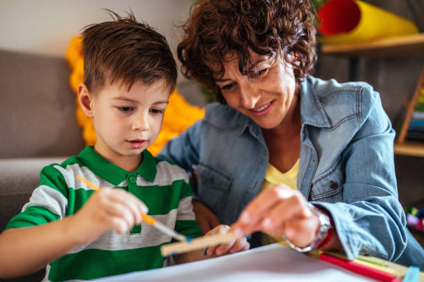 istock Mother and son coloring together 951044694