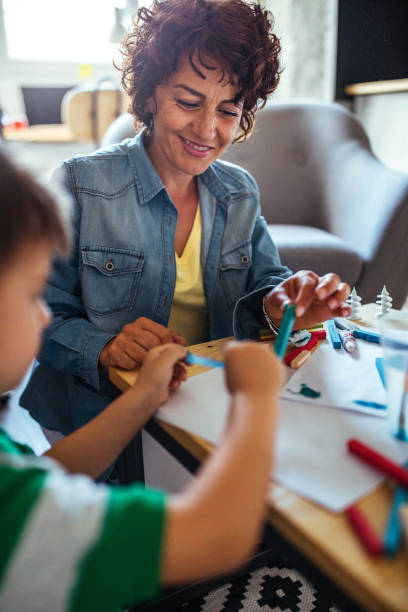 istock Mother and son coloring together 951045006