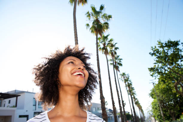 istock Close up african young woman outdoors and smiling 951045182