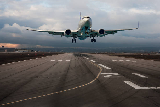 istock Passenger airplane taking off at dusk 951047044