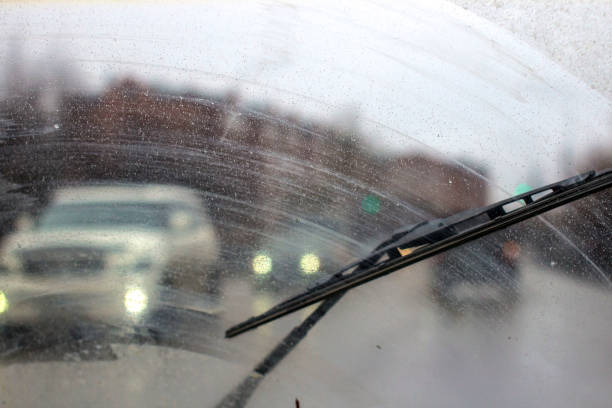 istock Windshield wipers from inside of car, season rain. 951047468