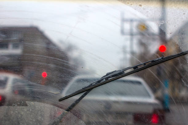 istock Windshield wipers from inside of car, season rain. 951047482