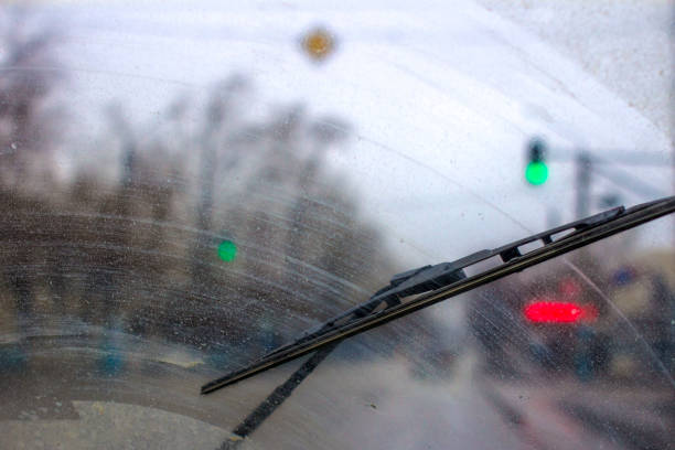 Windshield wipers from inside of car, season rain. Windshield wipers from inside of car, season rain. windshield wiper stock pictures, royalty-free photos & images