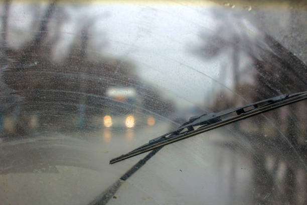 istock Windshield wipers from inside of car, season rain. 951047504