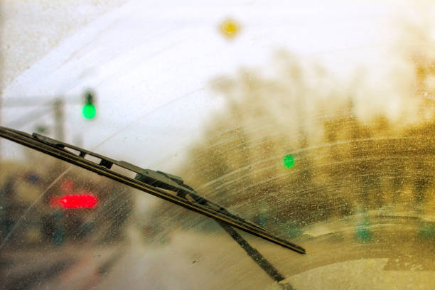 istock Windshield wipers from inside of car, season rain. 951047506