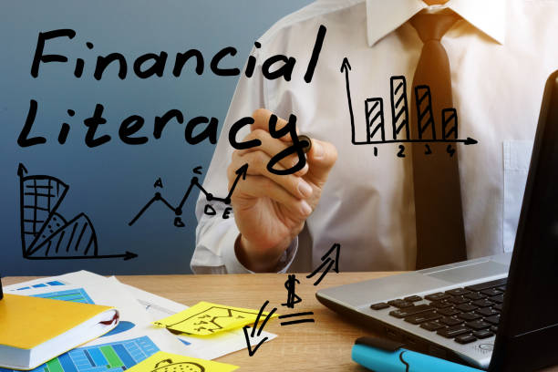Financial Literacy. Man at the office table. Financial Literacy. Man at the office table. financial literacy stock pictures, royalty-free photos & images