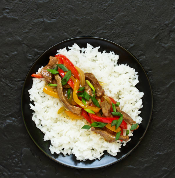 istock Stir fry with sage and pepper, with rice. 951049880