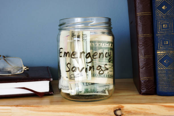istock Jar with Emergency savings Cash Fund on the shelf. 951051262