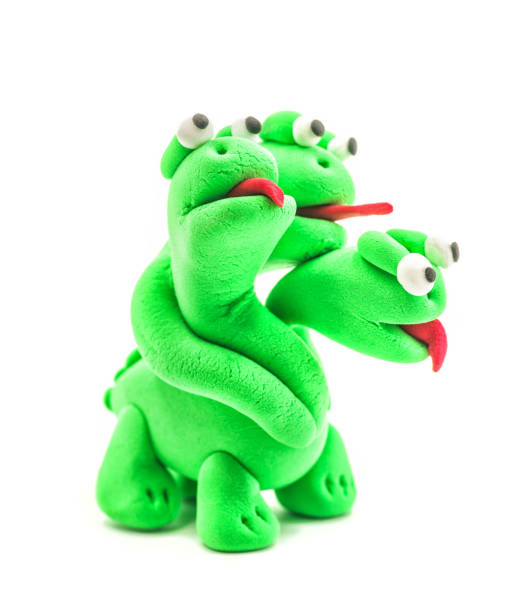 istock green hand made modeling clay dragon with three heads isolated on white 951051710