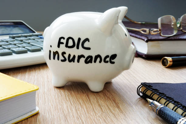 istock FDIC insurance policy on an office desk. 951053902