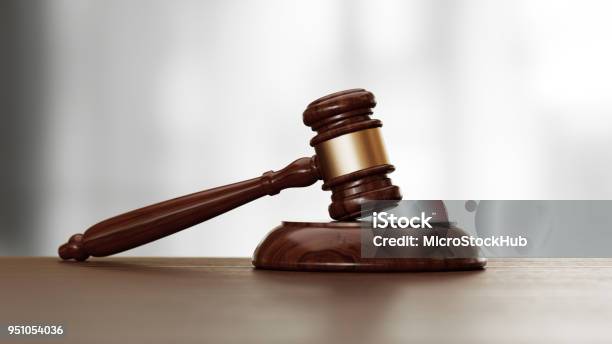 Wooden Gavel Over Defocused Background Stock Photo - Download Image Now - Gavel, Auction, Legal Trial