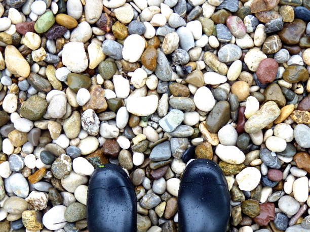 istock Tips on welly boots on pebble stones 951056130
