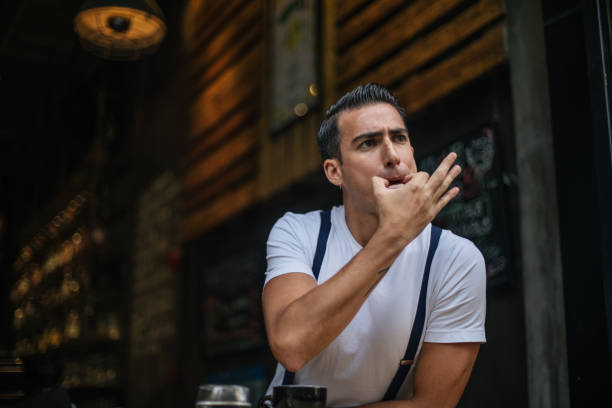 Guy whistling One man, young guy in cafe, he is on coffee break and whistling. whistle stock pictures, royalty-free photos & images