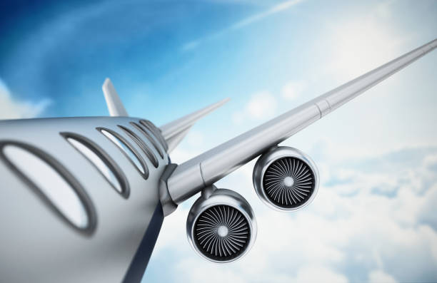istock Airplane wing and engines detail on blue sky 951059730