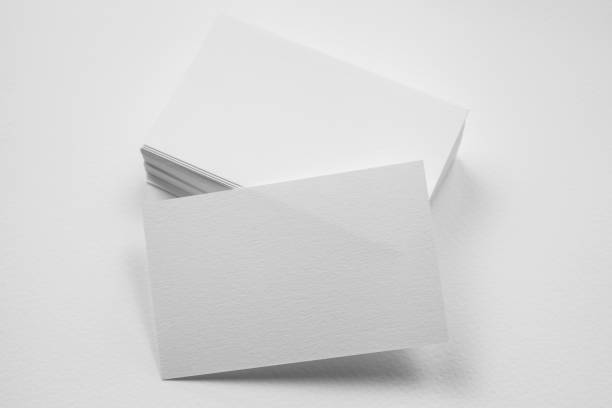 istock Stack of blank business card with one card in front on white background 951061460