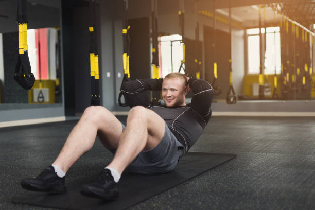 istock Young man fitness workout, sit-up crunches for abs 951064398