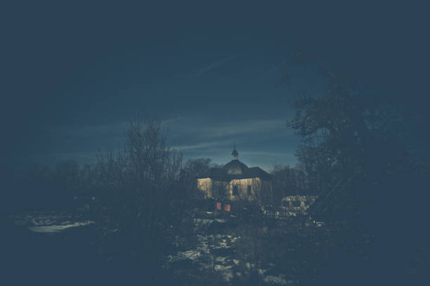 istock Old abandoned church by night in early springtime 951065384
