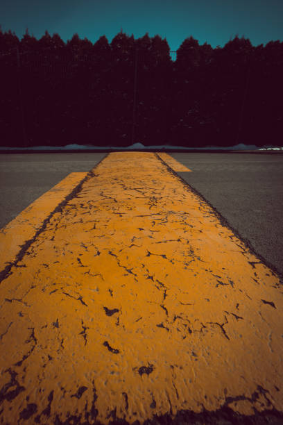 istock Yellow weathered and damaged road mark print 951065458
