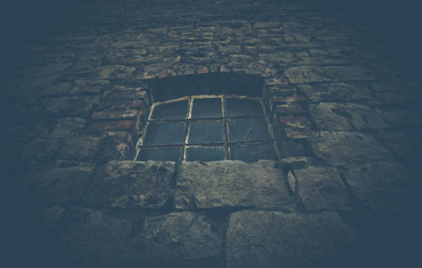 istock Old spooky window on an historical building 951067896
