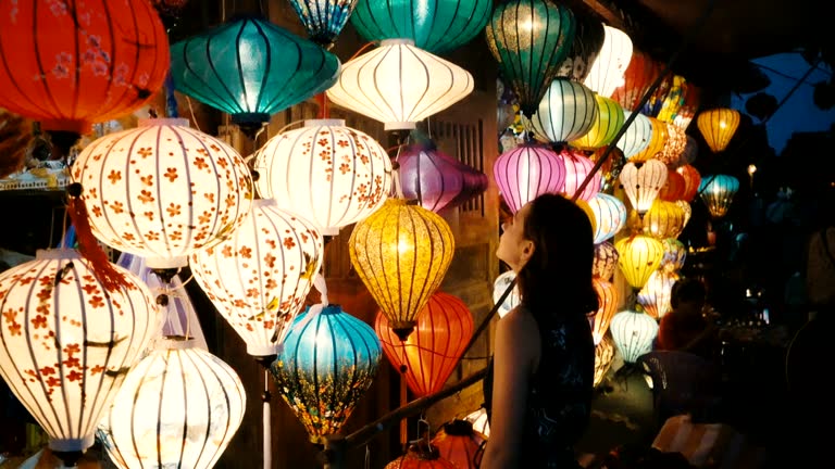 Woman choosing lanterns in Hoi An