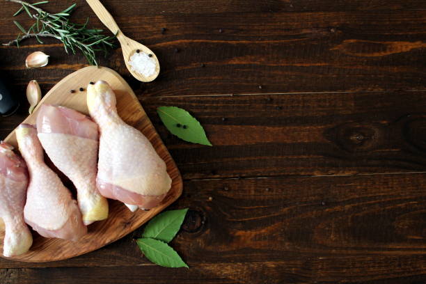istock Uncooked chicken with ingredients for cooking. 951068414