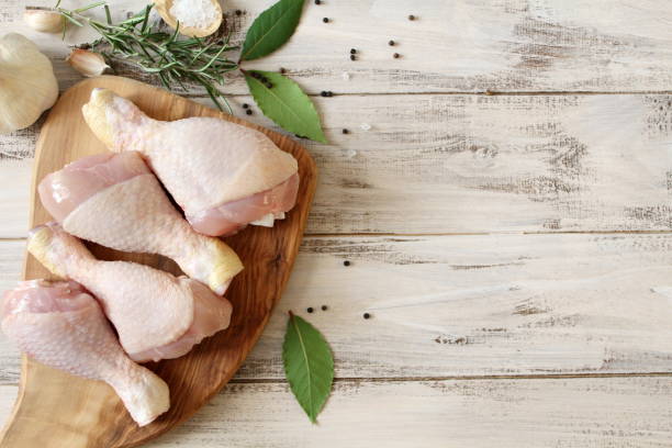 istock Uncooked chicken with ingredients for cooking. 951068696