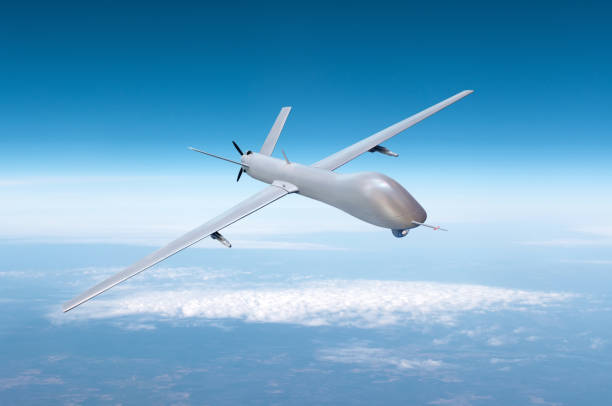 unmanned military drone on patrol air territory at high altitude. - air vehicle fotos imagens e fotografias de stock