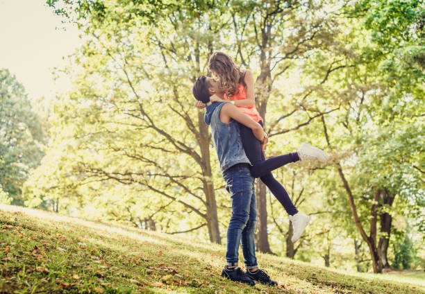 istock A man holding a girl on his arms. 951069684