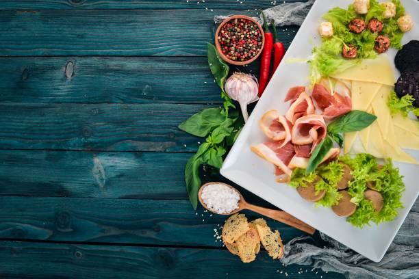 istock Cold snacks. Bacon, Cheese, Liver Paste. Top view. On a wooden background. Copy space. 951069918