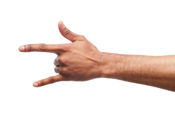 Male black hand making rock'n'roll gesture, closeup, isolated on white backgroung