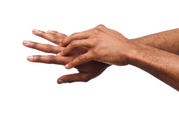 istock Black man applying hand cream at white isolated background 951070290