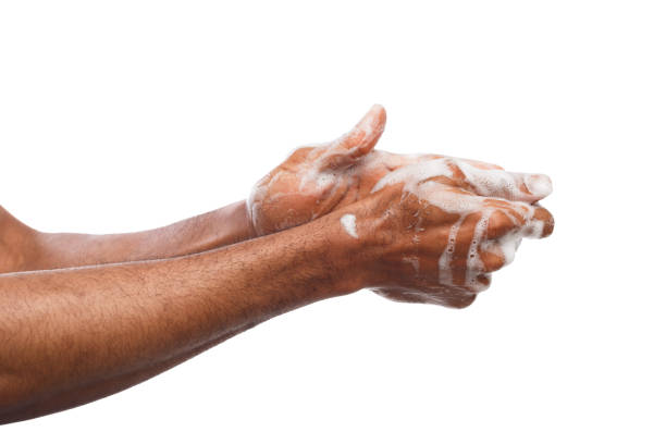 istock Black man washing hands isolated on white background 951070370