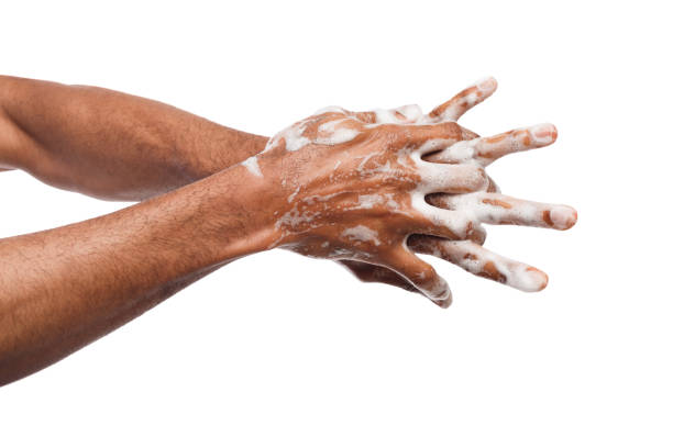 istock Black man washing hands isolated on white background 951070394