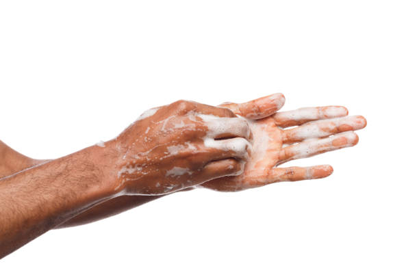 istock Black man washing hands isolated on white background 951070410