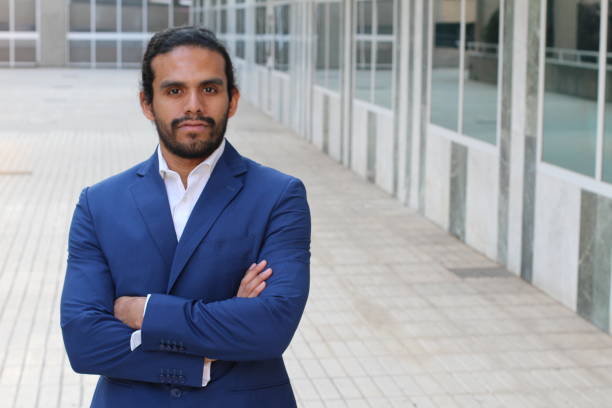 istock Handsome businessman outside the office building 951070568