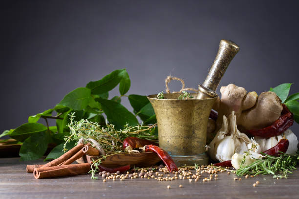 istock Different herbs and spices on a wooden table . 951077664
