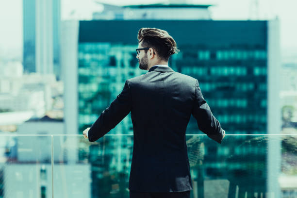 istock Young Businessman Looking at City 951078120
