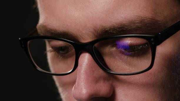 istock Close-up of a Man's Face Against a Black Background 951078280