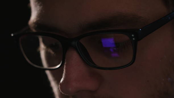 istock Close-up of a Man's Face Against a Black Background 951078314