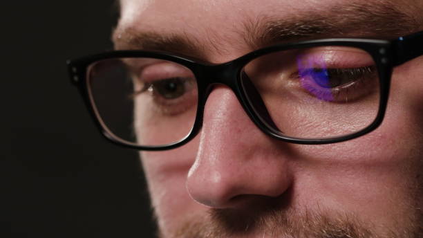 istock Close-up of a Man's Face Against a Black Background 951078464